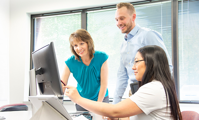 Team Interacting on Computer