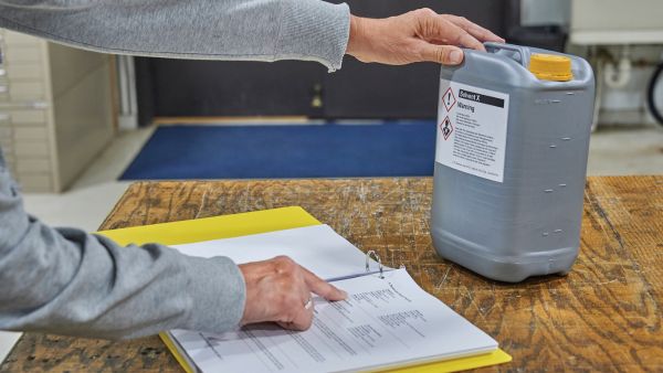 Person reading chemical labels