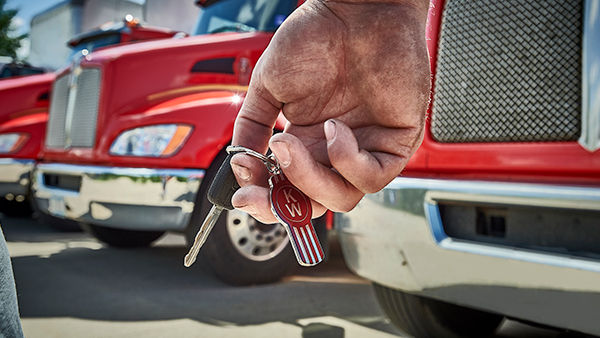 Driver holding keys