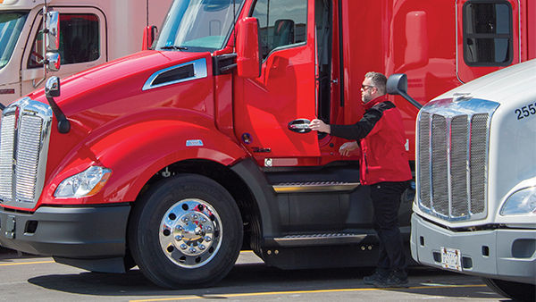 Driver entering red truck